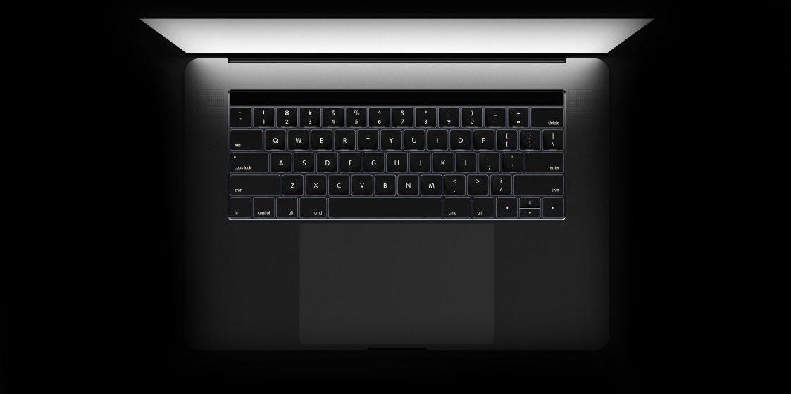 Wir sind der richtige Ansprechpartner für ein ansprechendes Shopdesign Eine Macbook-Tastatur von oben vor schwarzem Hintergrund
